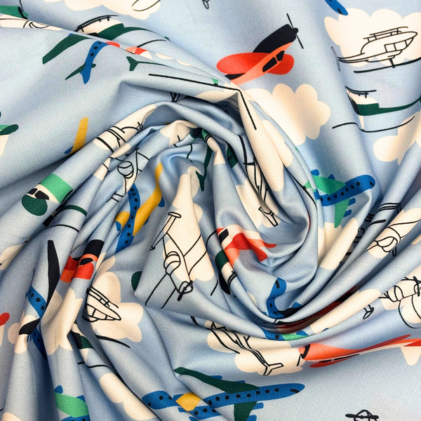 Tela Estampada de 100% Algodón 44/45" Aviones, Azul Claro - 1 yarda