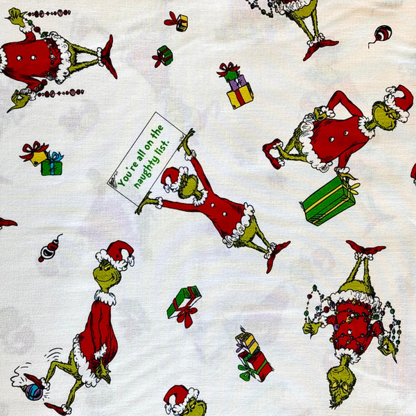 Tela Estampada de 100% Algodón , 44/45" Grinch Naughty List