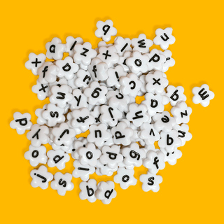 White Flowers with Black Alphabet Beads; 28 grams