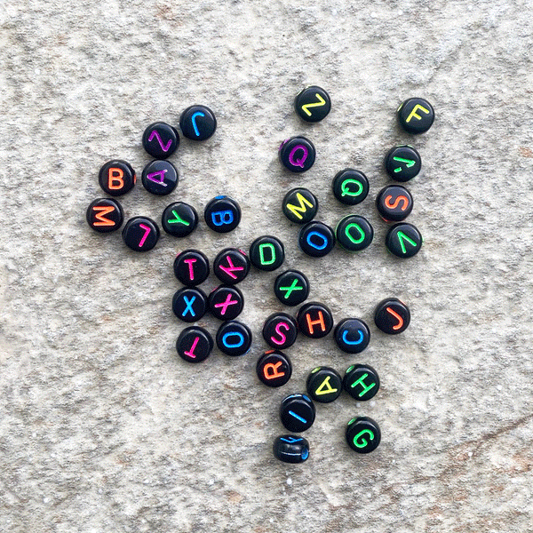 Black Background with Neon Alphabet Beads; 28 grams
